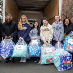 upper school students collecting donations for those less fortunate.