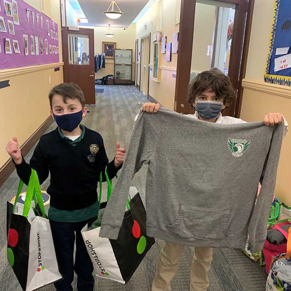 Oak Knoll second graders collected and sorted gently used sweaters for those in need who are serviced by Bridges Outreach and Catholic Charities.