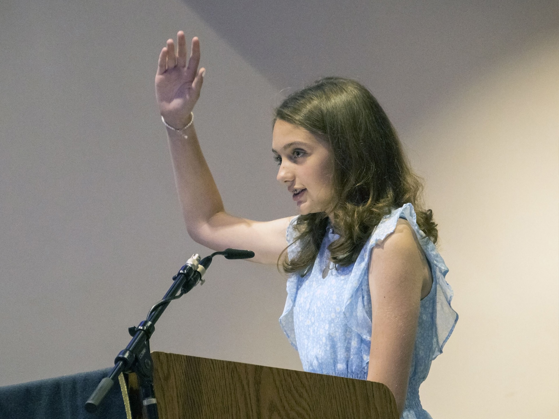 Student leads prayers of the faithful during Mass.