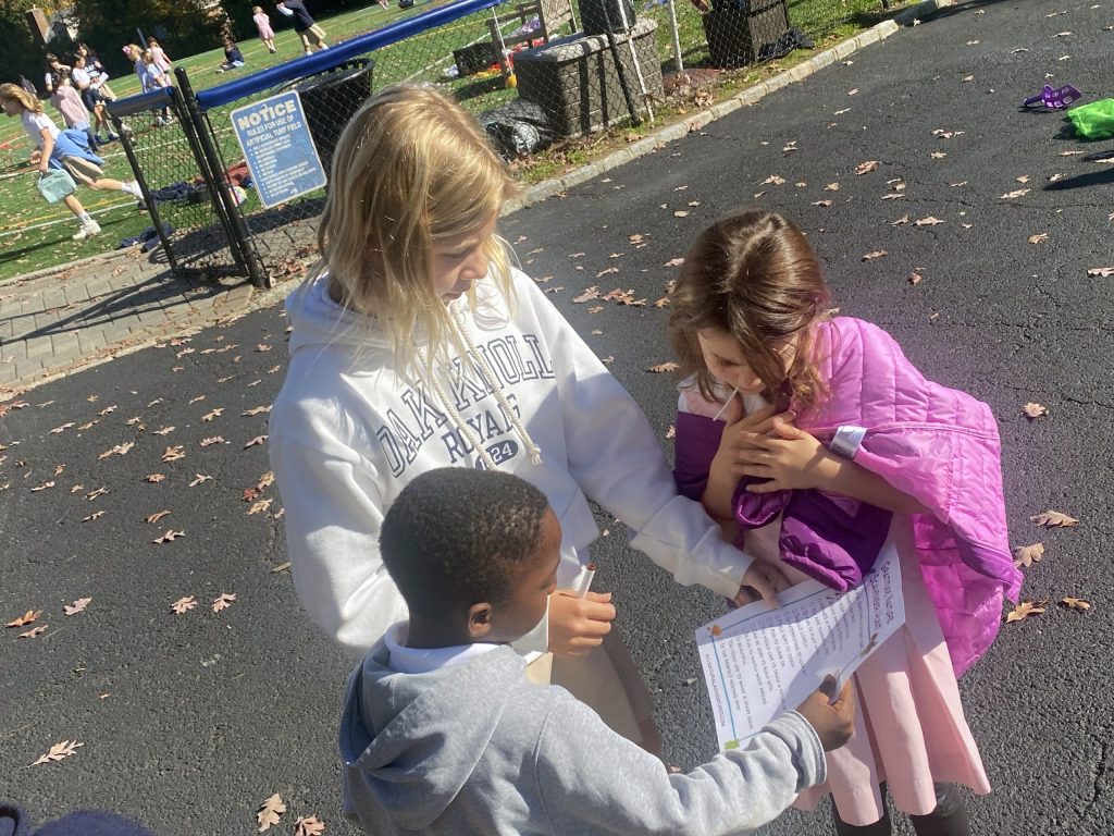 Once a month, grades one and five gather for a lunchtime discussion followed by a group activity. Each group consists of at least one grade five mentor and around five grade one students. During lunch, the older students lead a discussion based on the Lower School’s current monthly value.